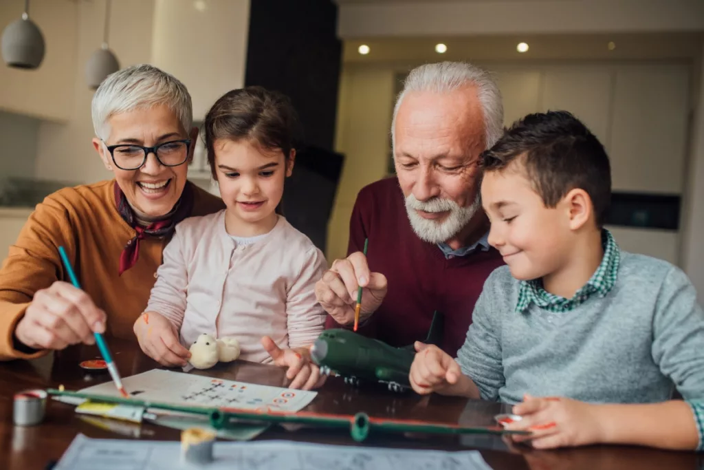 A heartwarming image of loving grandparents spending quality time with their grandkids, capturing the essence of familial bonds, shared moments, and the intergenerational connection in a relaxed setting.